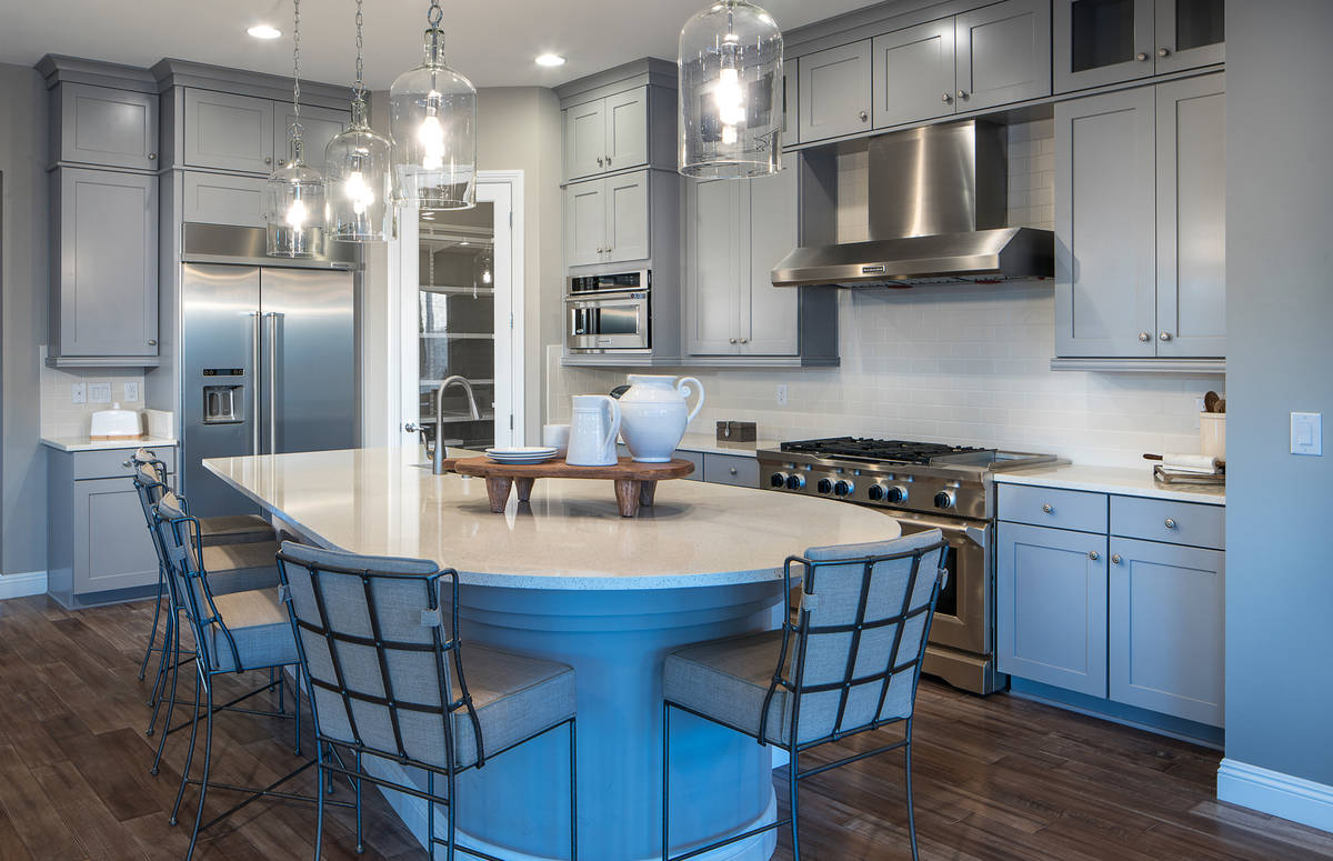 Woodside Homes' Varenna in Lake Las Vegas includes a well-appointed kitchen with a large island ...