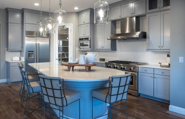 Woodside Homes' Varenna in Lake Las Vegas includes a well-appointed kitchen with a large island ...