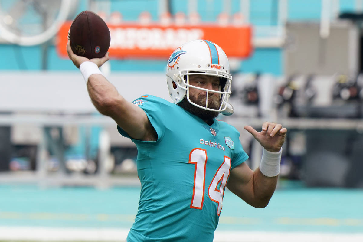 Miami Dolphins quarterback Ryan Fitzpatrick (14) warms up before an NFL football game against t ...