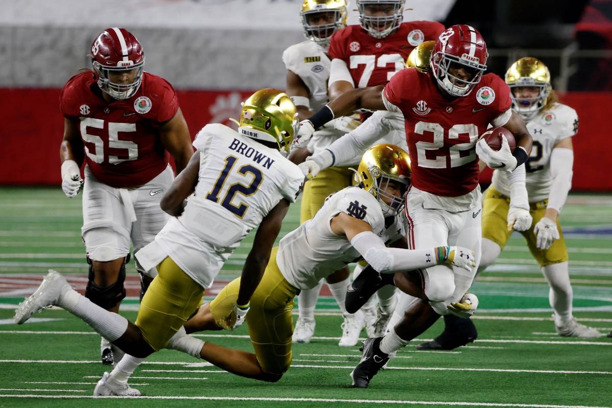 Notre Dame safety DJ Brown (12) and others attempt to stop Alabama running back Najee Harris (2 ...