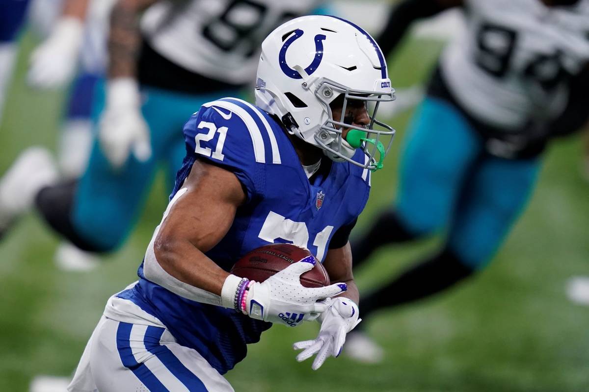 Indianapolis Colts' Nyheim Hines (21) runs during the first half of an NFL football game agains ...