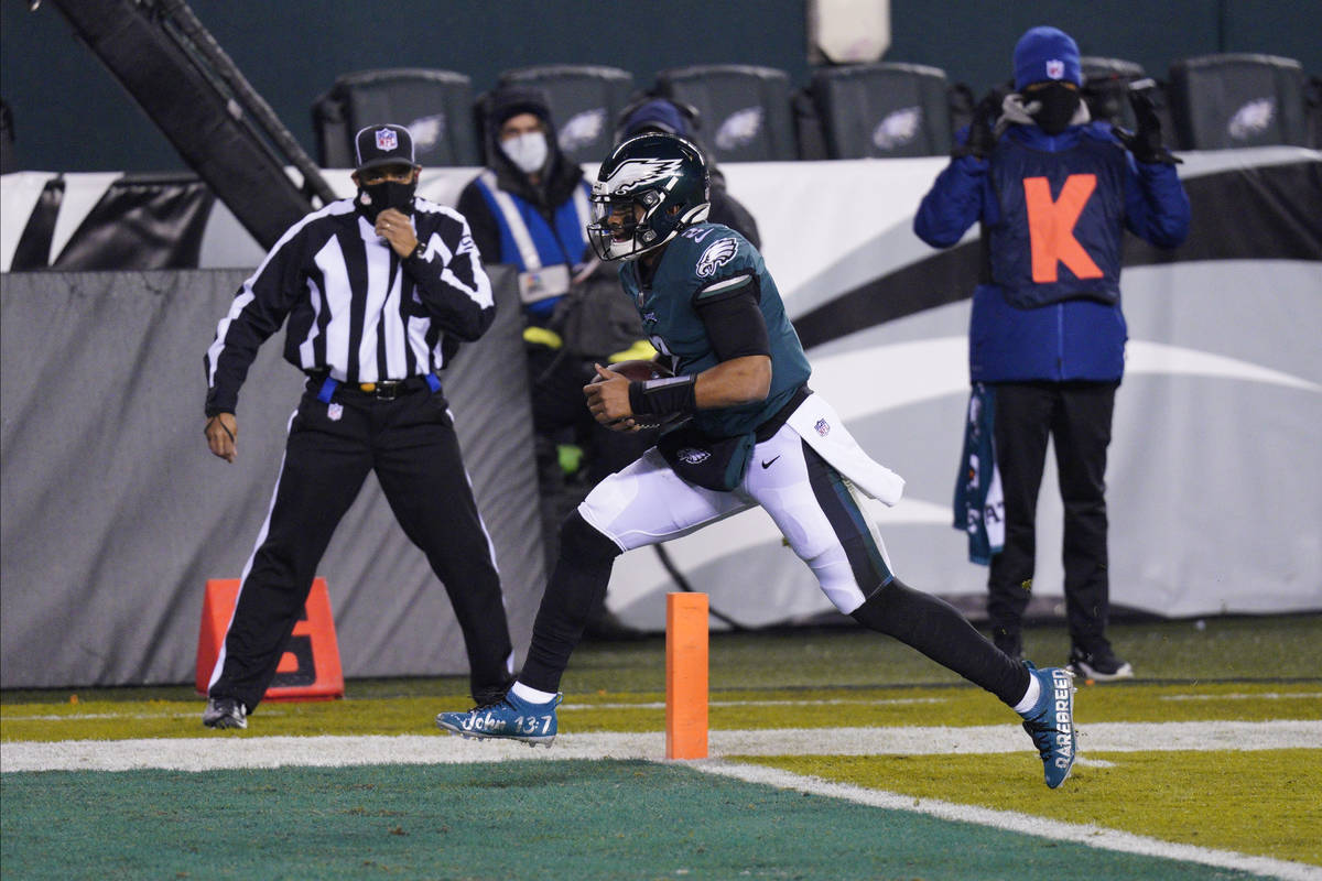 Philadelphia Eagles' Jalen Hurts scores a touchdown during the first half of an NFL football ga ...