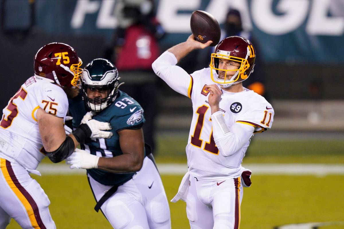 Washington Football Team's Alex Smith plays during the first half of an NFL football game again ...