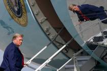 FILE - In this Dec. 31, 2020, file photo President Donald Trump boards Air Force One at Palm Be ...