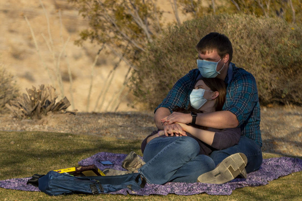 Illonna Biondo and Cameron Swan wear masks to prevent the spread of coronavirus while enjoying ...