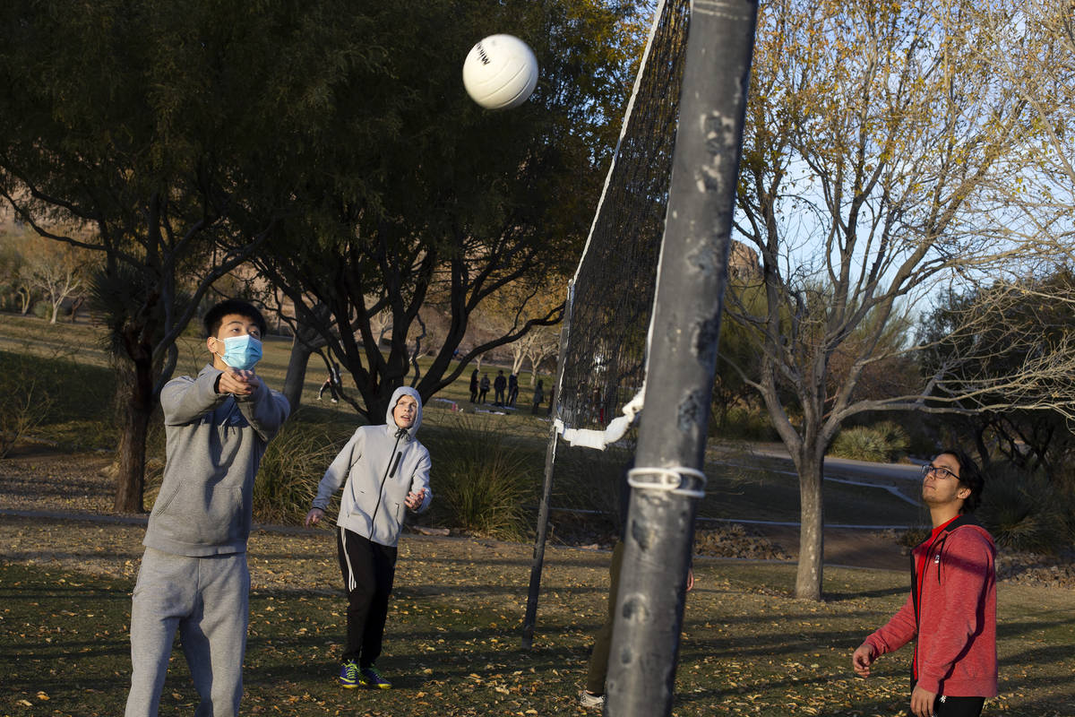 Nathan Zhang, left, plays volleyball with friends at Exploration Peak Park on Saturday, Jan. 2, ...