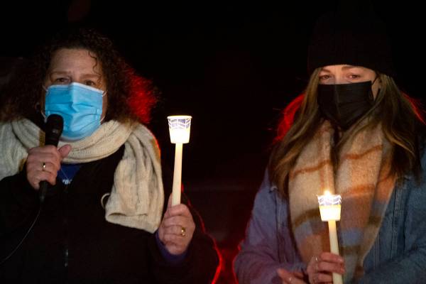 Annmarie Echevarria, left, and Ashley Robledo speak at a vigil for Eric Echevarria, their husba ...