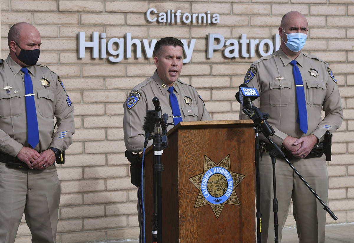 California Highway Patrol Captain Kevin Clays, center, updates the media about Friday's fatal c ...