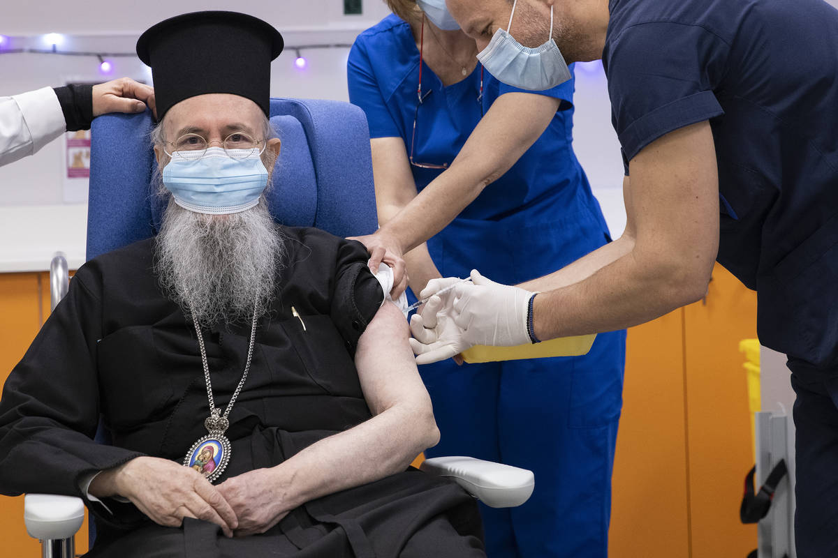 Metropolitan Hierotheos of Nafpaktos and Agios Vlasios receives an injection with a dose of COV ...