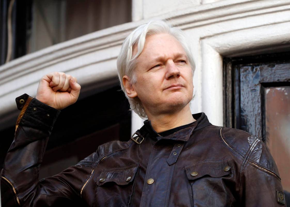 In a May 19, 2017, file photo, WikiLeaks founder Julian Assange greets supporters outside the E ...