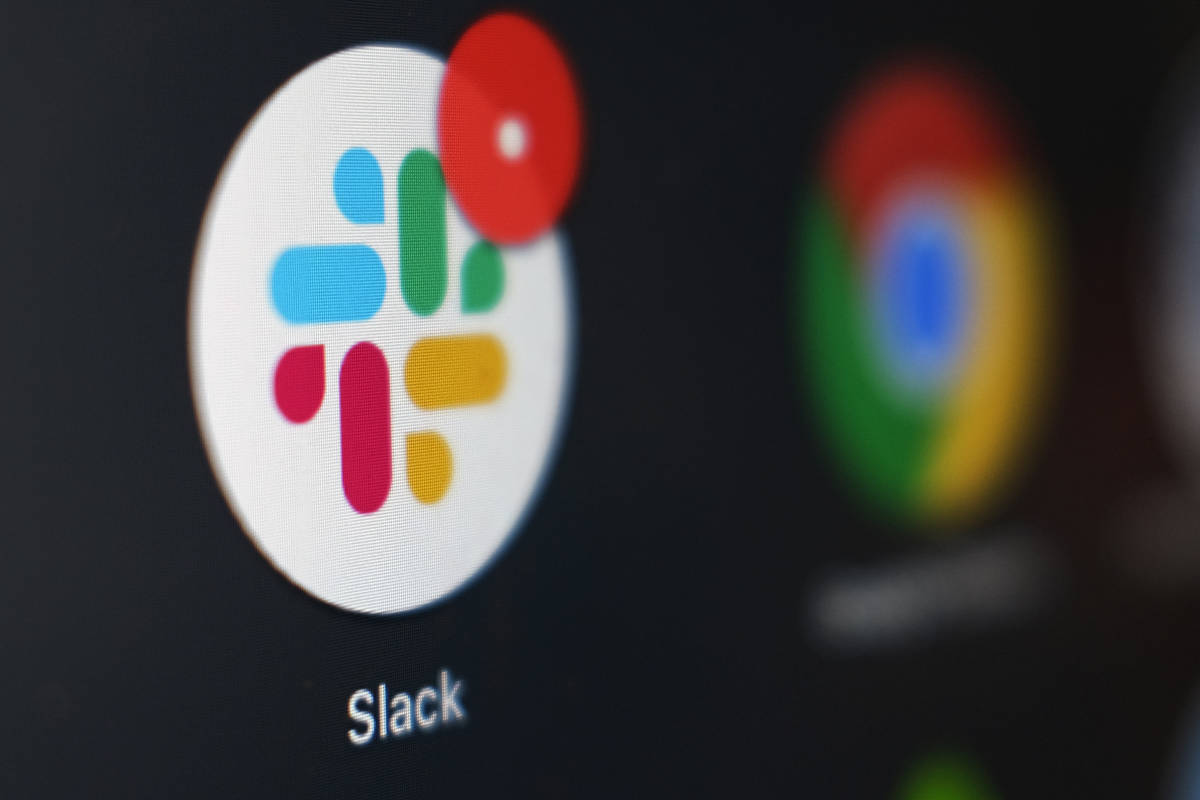 This Dec. 2, 2020, file photo shows the Slack app icon being displayed on a computer screen in ...