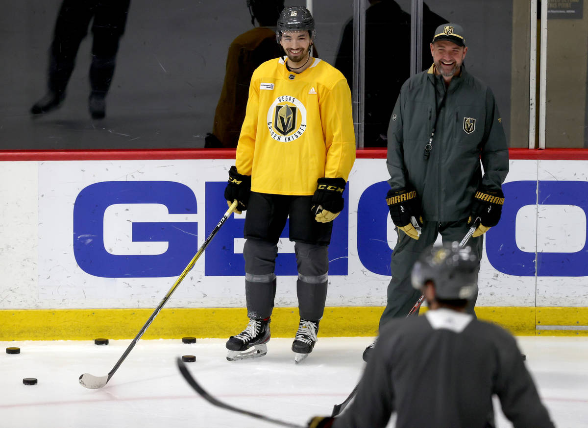 Golden Knights Coach Pete DeBoer, right and forward Dylan Sikura on the first day of training c ...