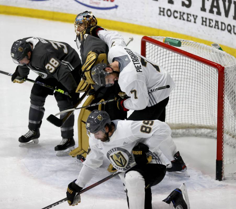 Golden Knights defenseman Alex Pietrangelo (7), jokes with goaltender Marc-Andre Fleury (29) af ...