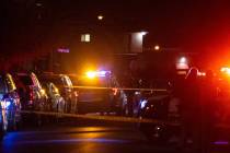 Las Vegas police respond to the scene of a homicide on Dunsbach Way, near East Lake Mead Boulev ...