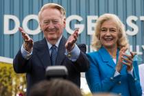 In this Monday, April 11, 2016, file photo, Los Angeles Dodgers legend Vin Scully, left, with h ...