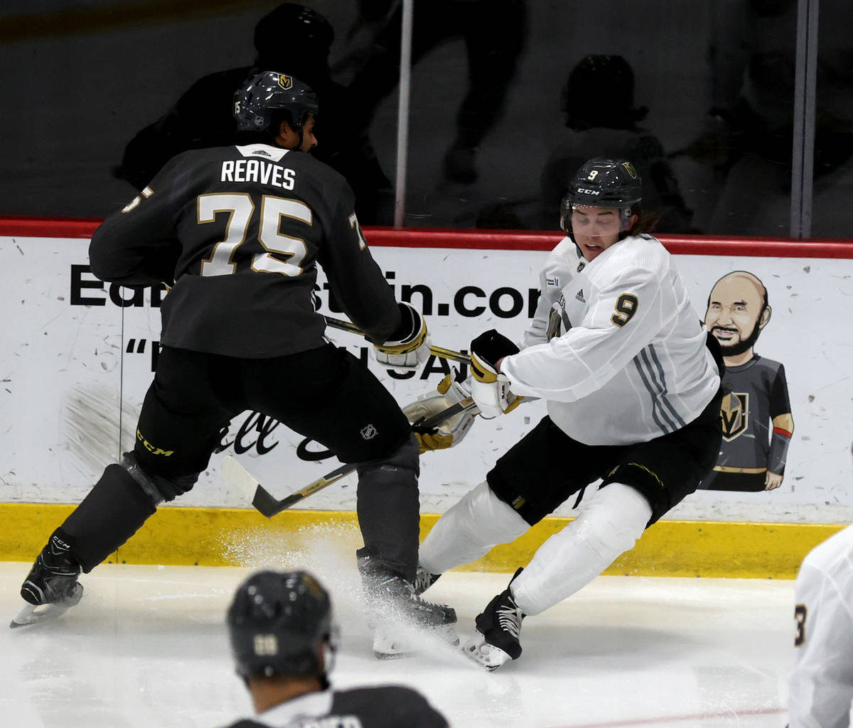 Golden Knights center Cody Glass (9) battles for the puck with right wing Ryan Reaves (75) duri ...
