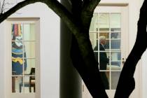 Vice President Mike Pence walks through the Oval Office before President Donald Trump departs t ...