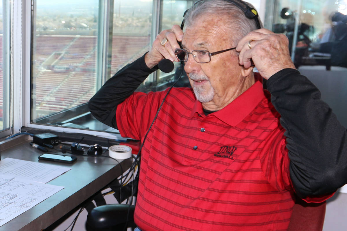 The "Voice of the Rebels", Dick Calvert, puts on his headset prior to calling the act ...