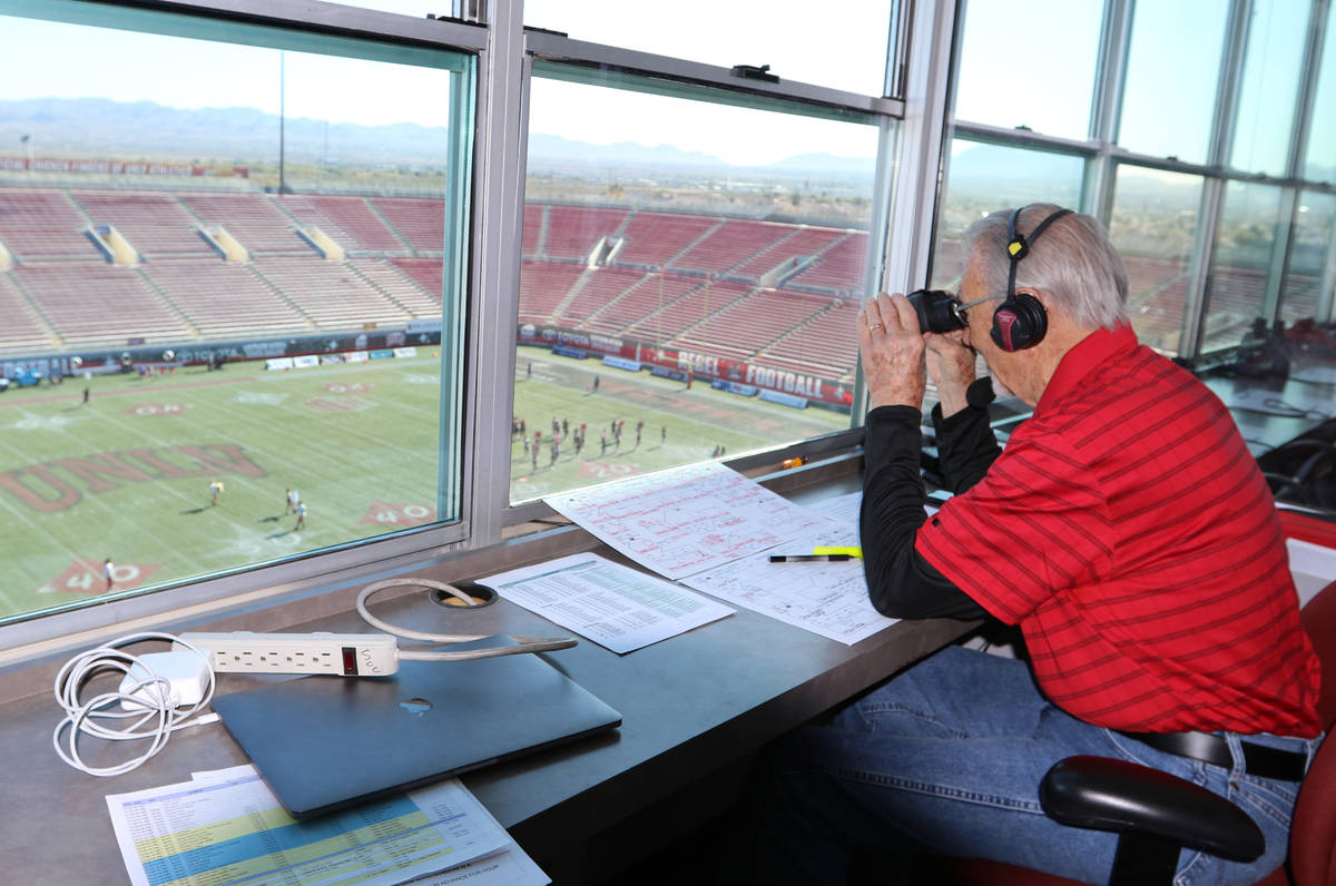 The "Voice of the Rebels", Dick Calvert, looks out to the field at Sam Boyd Stadium p ...