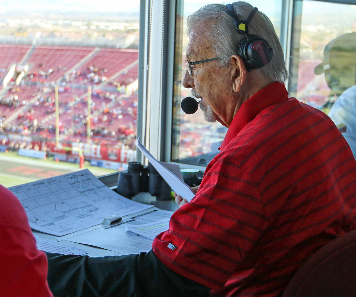 UNLV Rebels announcer, Dick Calvert, calls the action during the first half of a college footba ...