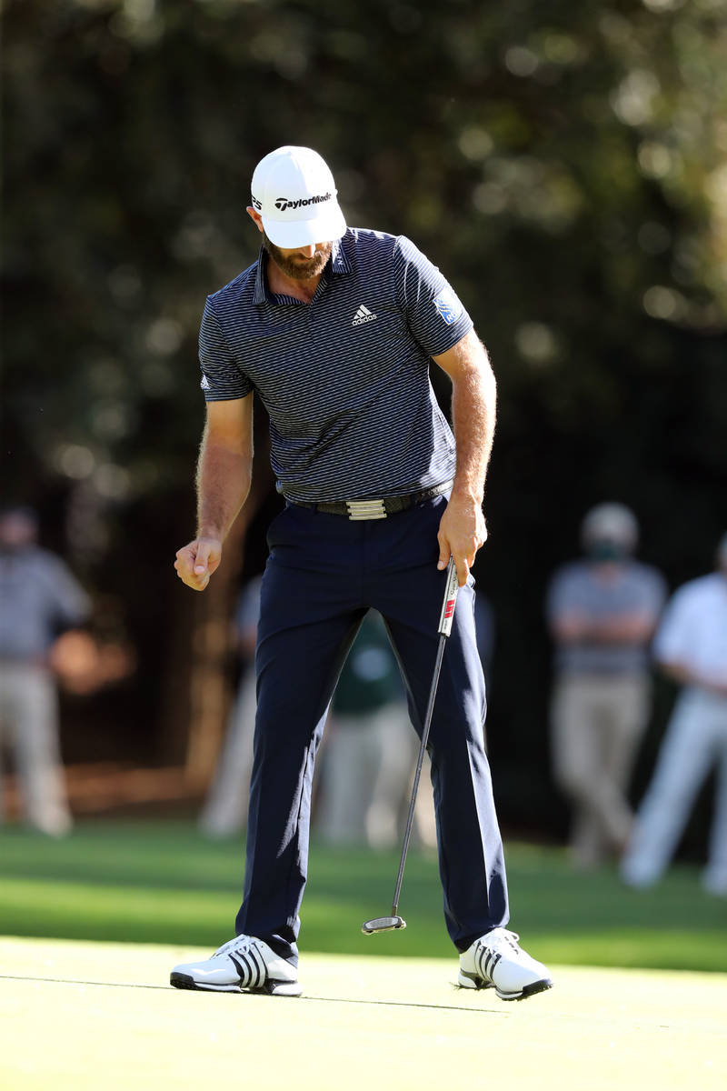 Dustin Johnson reacts after making a birdie on the 15th hole during the final round of the Mast ...
