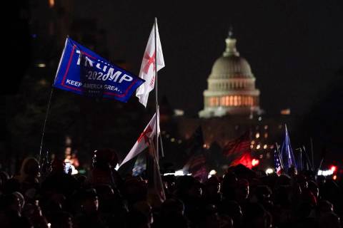 People attend a rally at Freedom Plaza Tuesday, Jan. 5, 2021, in Washington, in support of Pres ...