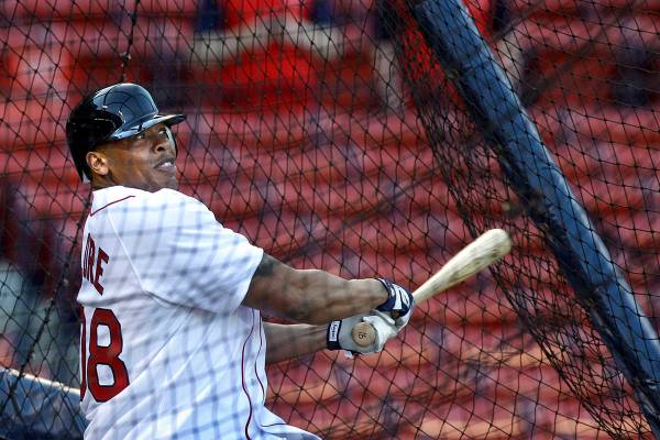 Rapper and producer Dr. Dre takes batting practice at Fenway Park before the opening game of th ...