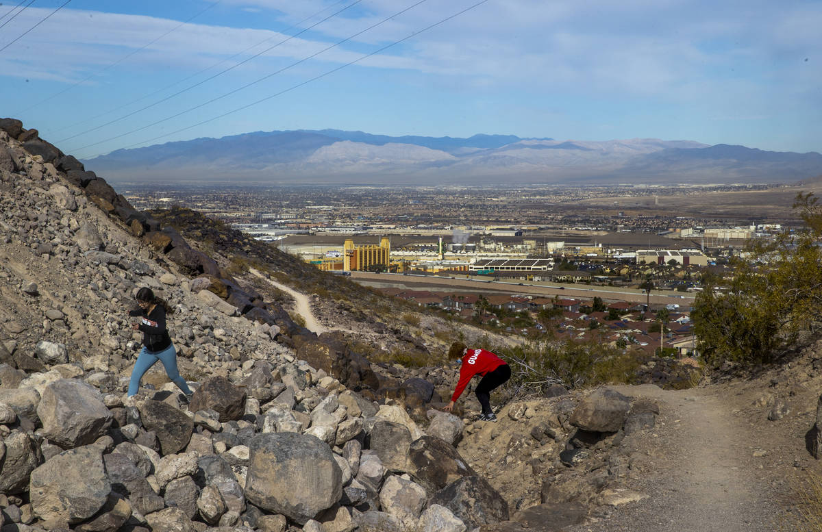 Miriam Hejji, right, and friend Nictoria Pleasant-Rede hike along the Amargosa Trail in Henders ...