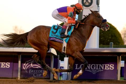 John Velazquez (9) rides Authentic to win the Breeder's Cup Classic horse race at Keeneland Rac ...