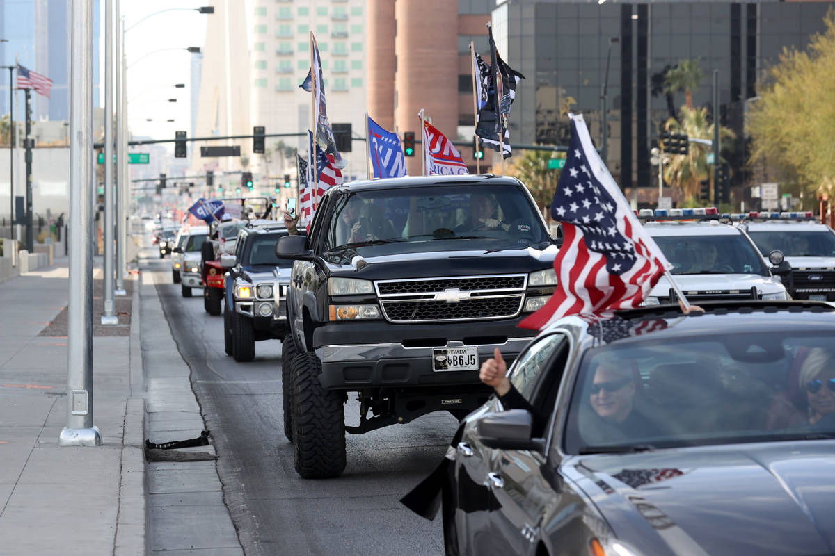 Protesters in a pro-Trump car parade outside the Lloyd George U.S. Courthouse in downtown Las V ...