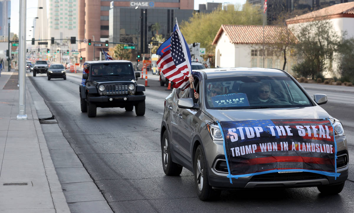 Protesters in a pro-Trump car parade outside the Lloyd George U.S. Courthouse in downtown Las V ...