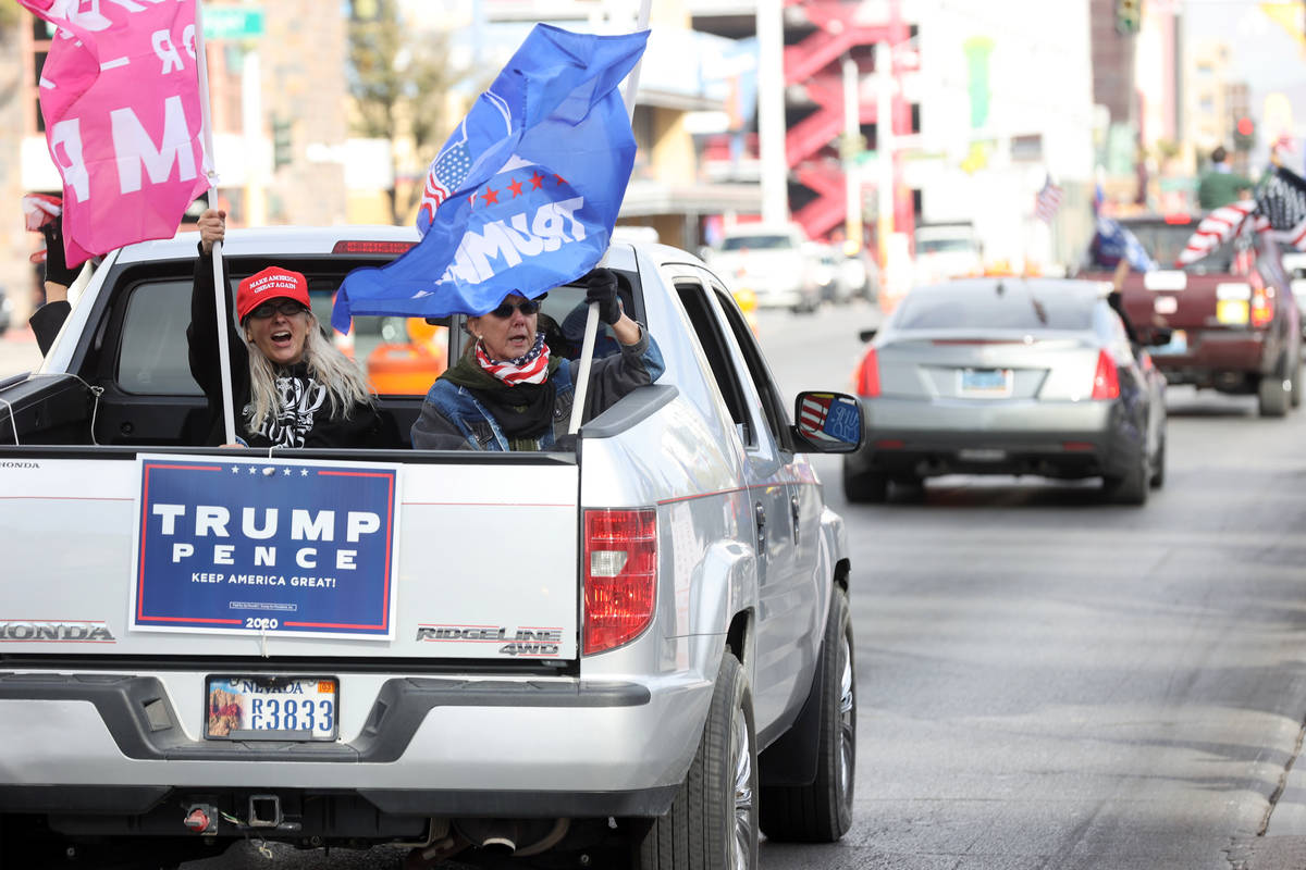 Protesters in a pro-Trump car parade outside the Lloyd George U.S. Courthouse in downtown Las V ...