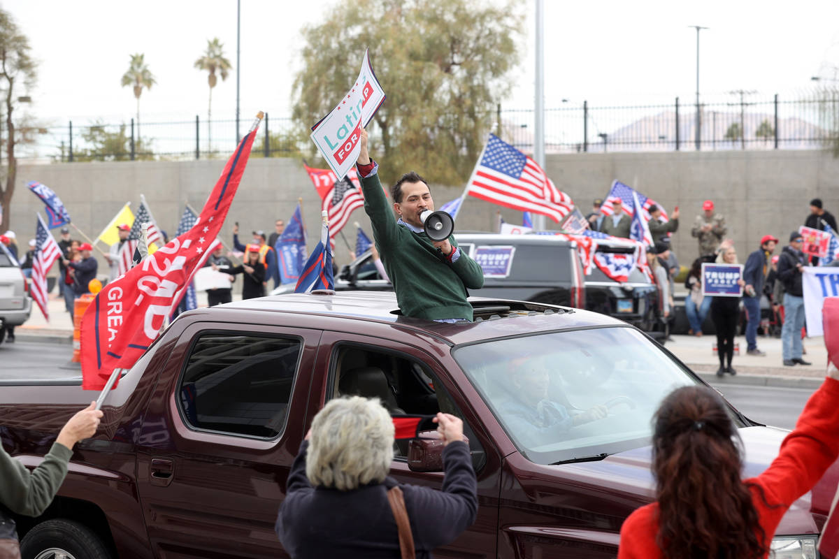 Protesters in a pro-Trump car parade outside the Lloyd George U.S. Courthouse in downtown Las V ...