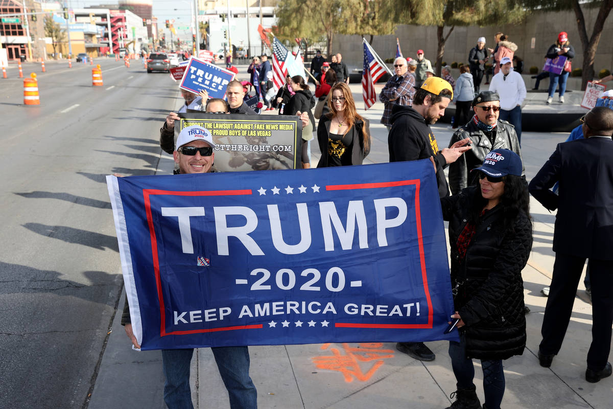 Pro-Trump protesters, including Michael Caruso and his wife Ursula Arbaiza of Las Vegas rally o ...