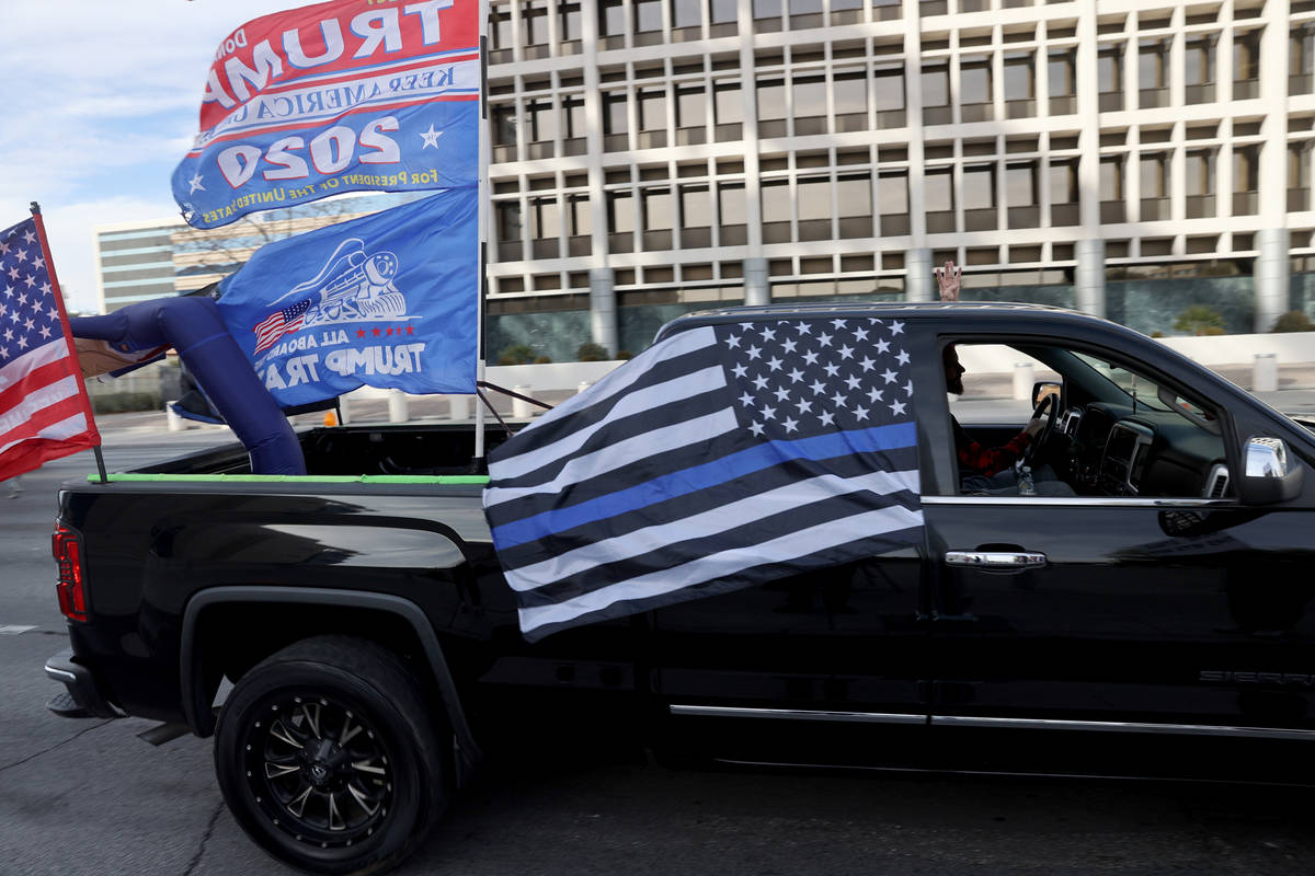 Protesters in a pro-Trump car parade outside the Lloyd George U.S. Courthouse in downtown Las V ...