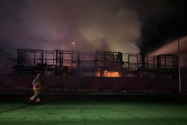 Las Vegas firefighters battle a fire at the Winslow condo development in the 5700 block of Sky ...