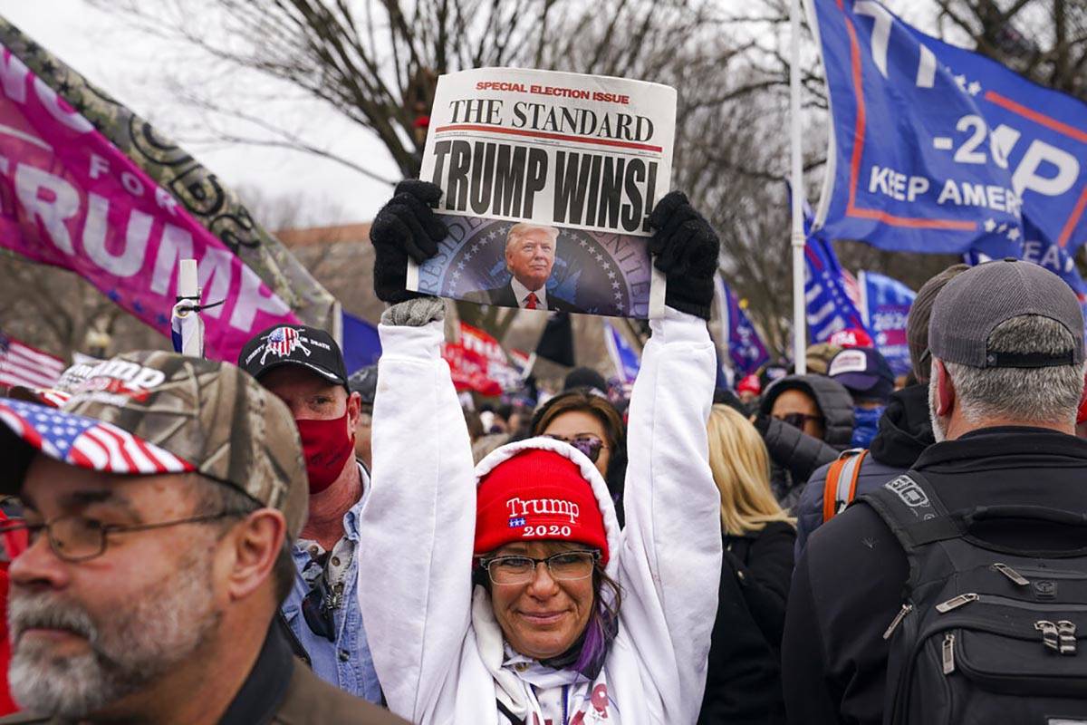 Trump supporters participate in a rally Wednesday, Jan. 6, 2021 in Washington. (AP Photo/John M ...
