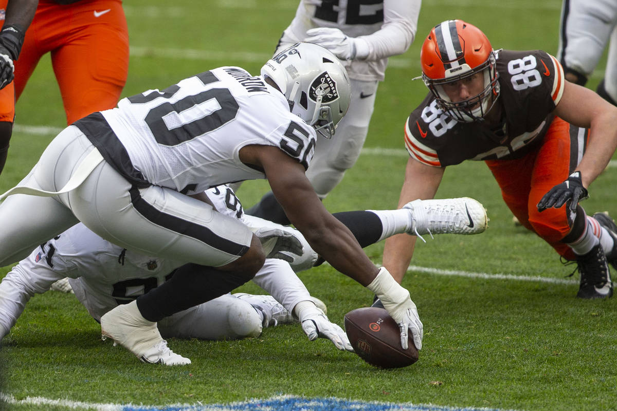 Las Vegas Raiders linebacker Nicholas Morrow (50) reaches to recover a fumble made by Cleveland ...