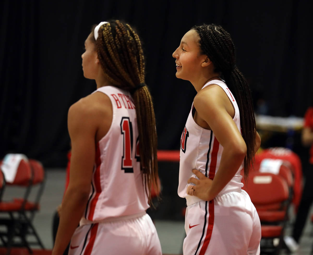 UNLV Lady Rebels guard Bailey Thomas (14), left, and guard Jade Thomas (5), are seen on the cou ...