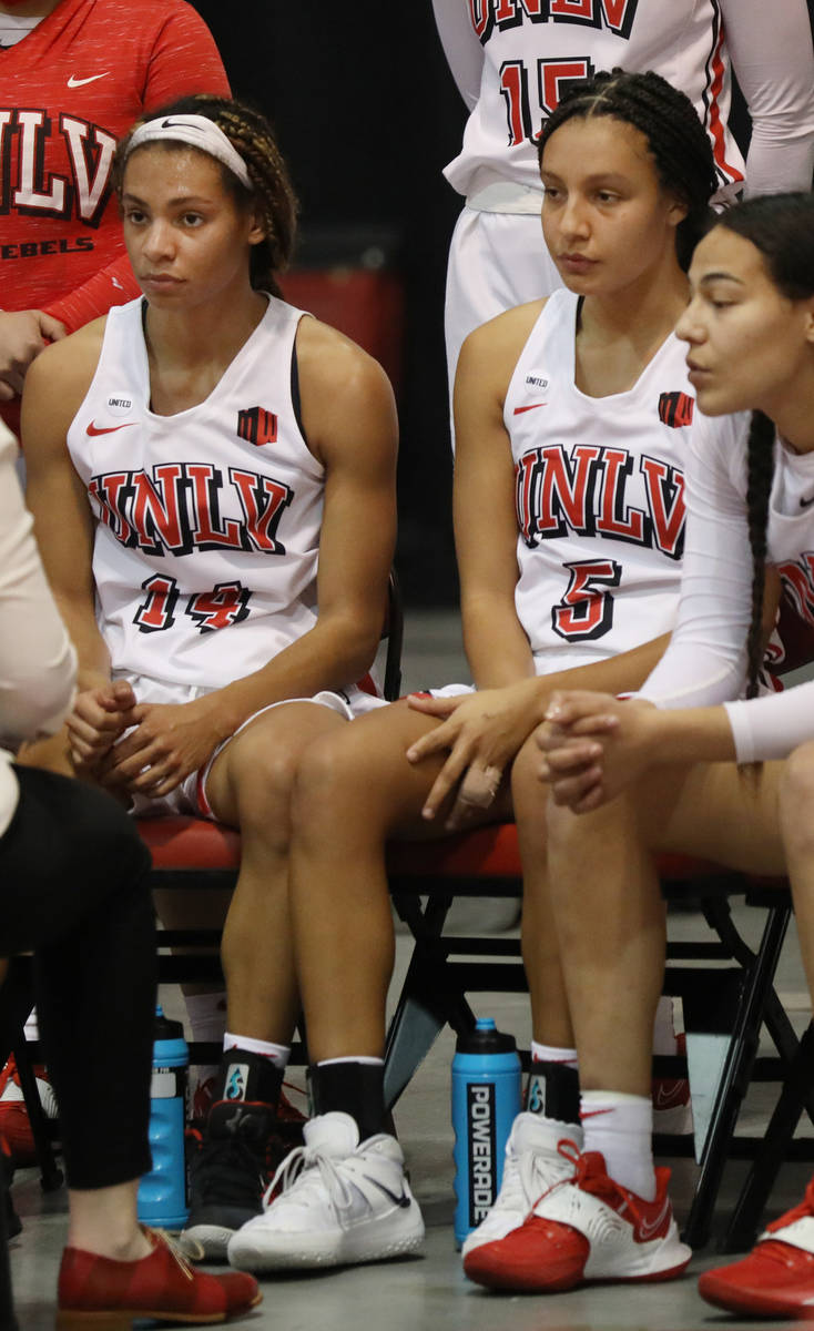 UNLV Lady Rebels guard Bailey Thomas (14), left, and guard Jade Thomas (5), are seen during a t ...