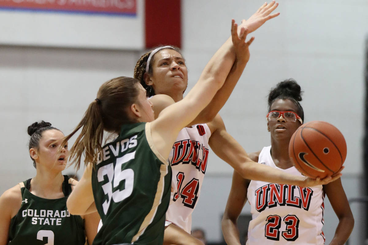 UNLV Lady Rebels guard Bailey Thomas (14) takes a shot against Colorado State University at Cox ...