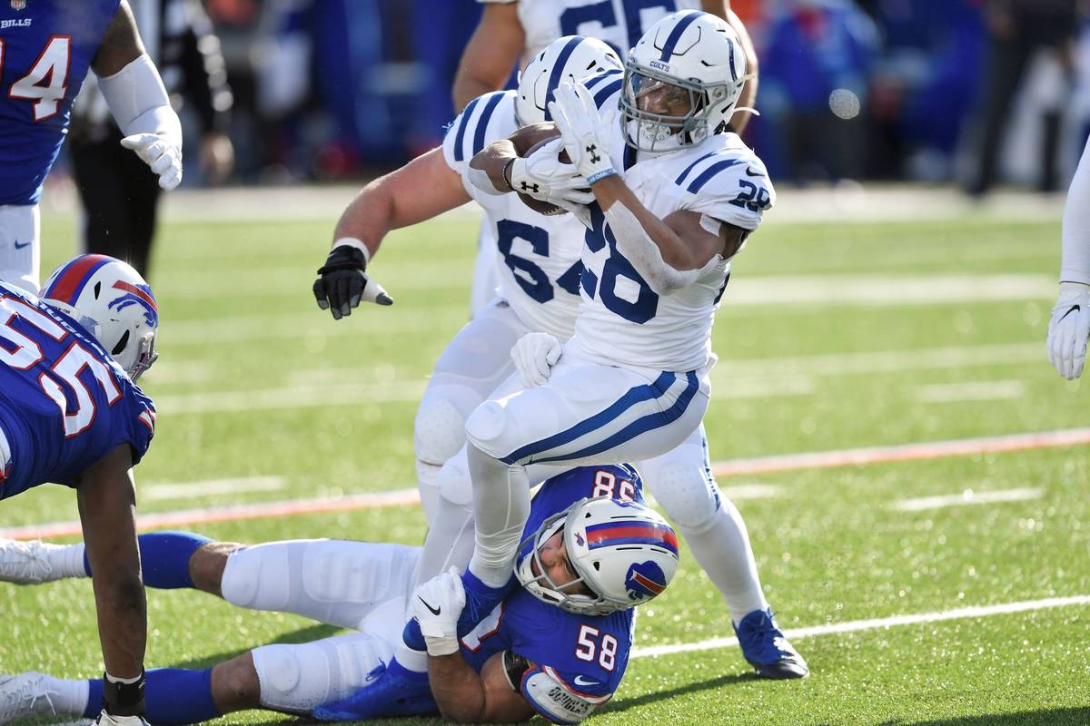 Buffalo Bills' Matt Milano (58) tackles Indianapolis Colts' Jonathan Taylor (28) during the fir ...