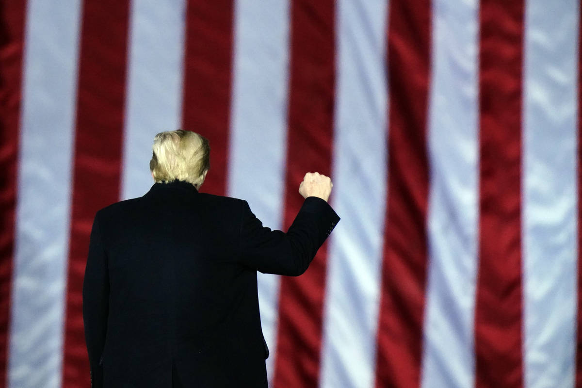 President Donald Trump gestures at a campaign rally in support of U.S. Senate candidates Sen. K ...