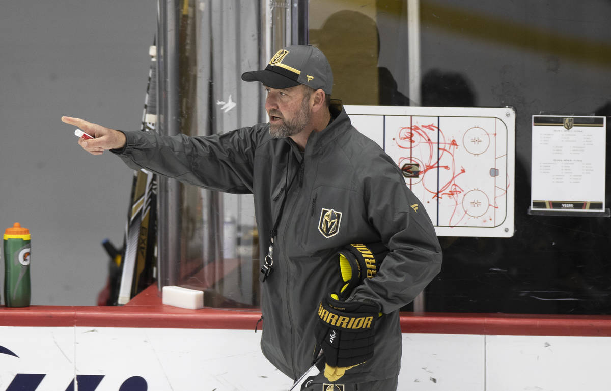 Golden Knights head coach Peter DeBoer gives direction to his players during practice at City N ...