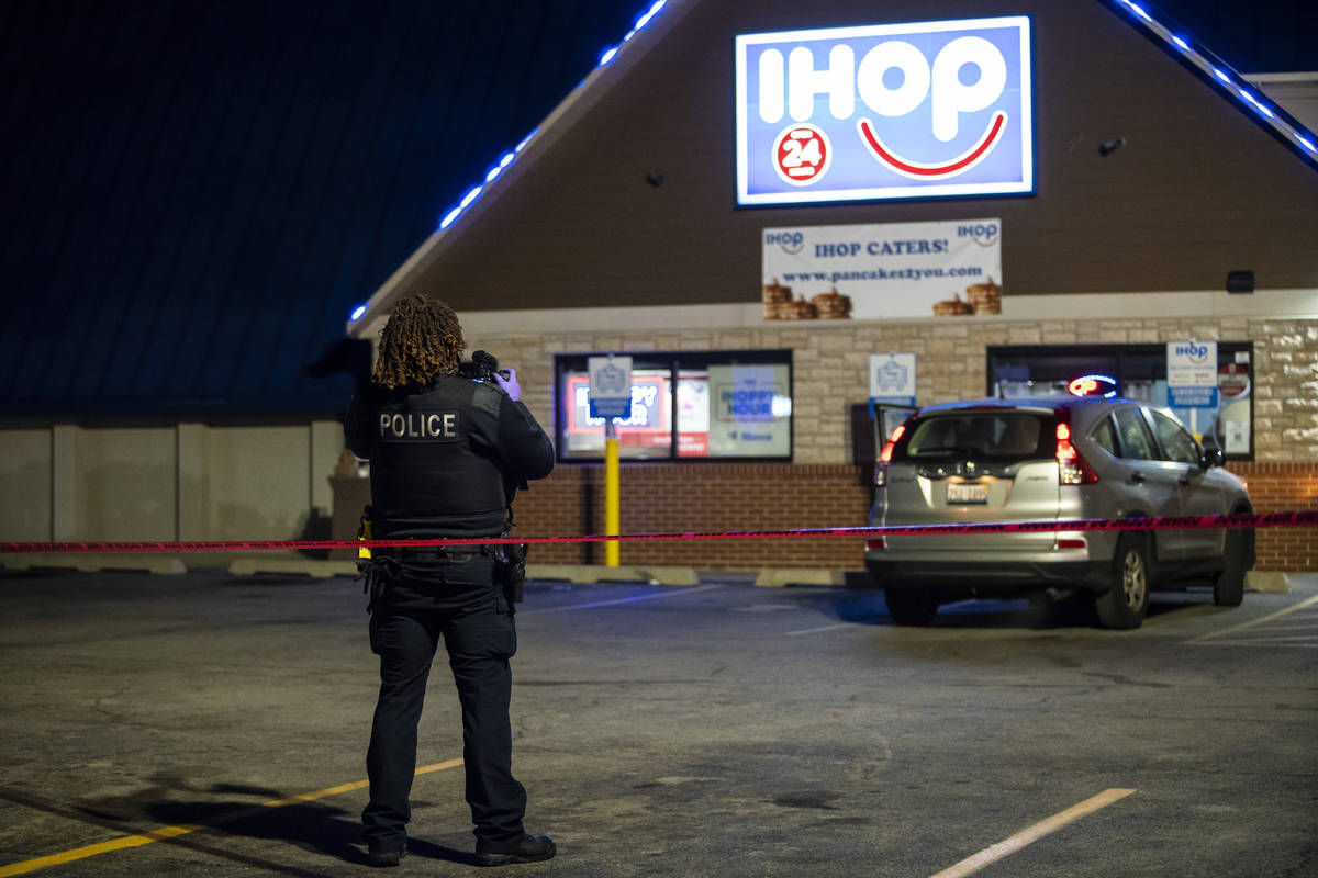 Chicago and Evanston police investigate the scene of a shooting outside an IHOP restaurant in E ...