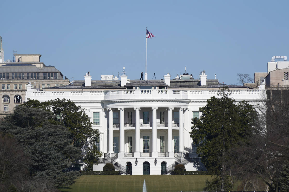An American flag flies above the White House in Washington, Saturday, Jan. 9, 2021. (AP Photo/P ...