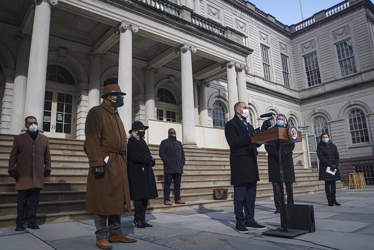 Congressman Hakeem Jeffries D-NY, third from right, speaks during a news conference at City Ha ...