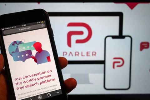 The website of the social media platform Parler is displayed in Berlin, Jan. 10, 2021. The plat ...