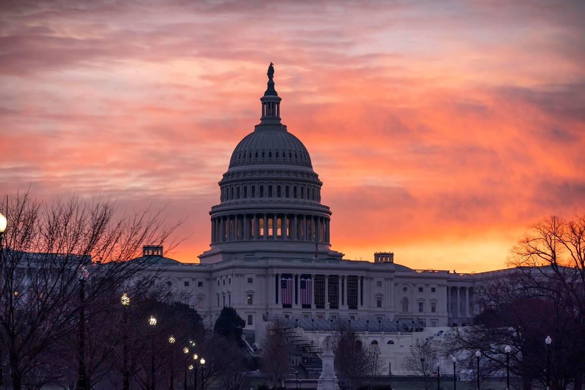 Dawn breaks at the Capitol in Washington, Monday, Jan. 11, 2021. (AP Photo/J. Scott Applewhite)