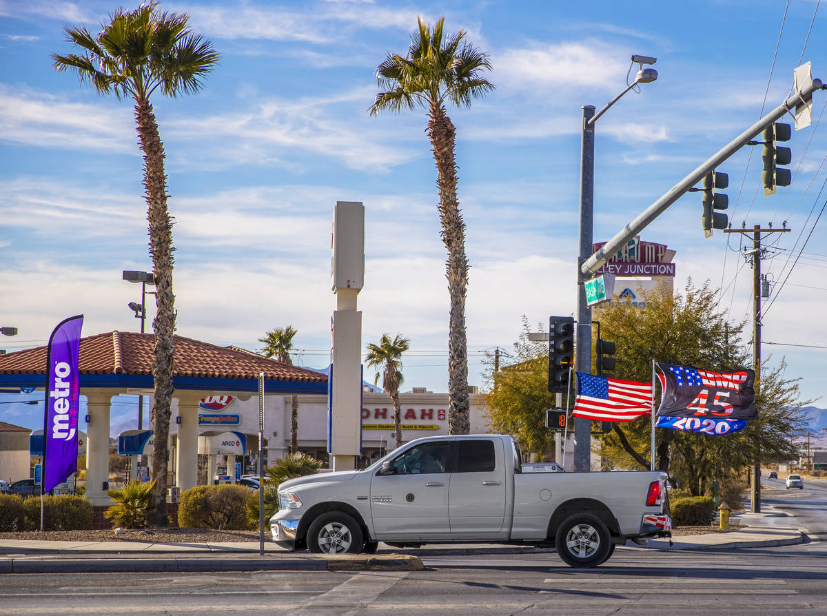 A supporter of President Trump drives their truck on South Highway 160 in Pahrump, Nev. on Mond ...